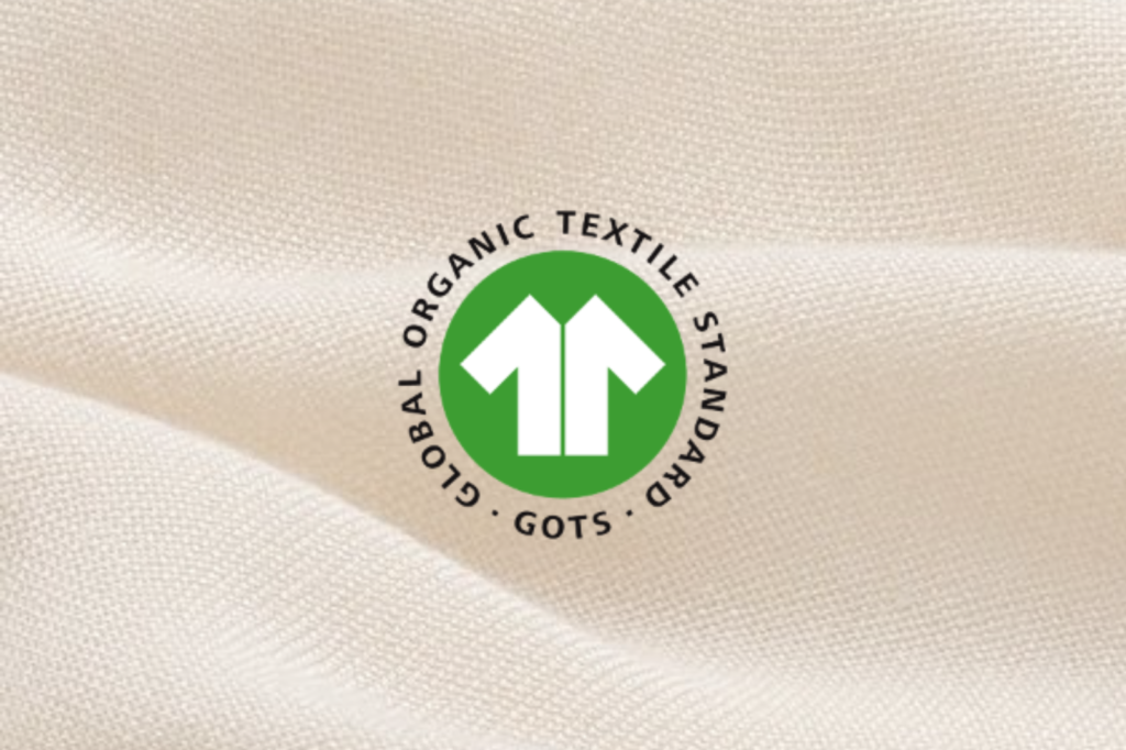Close-up of the GOTS logo on fabric showing GOTS certification for organic textile products.